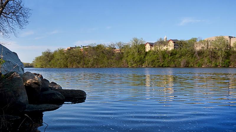 Riverbank with campus in background